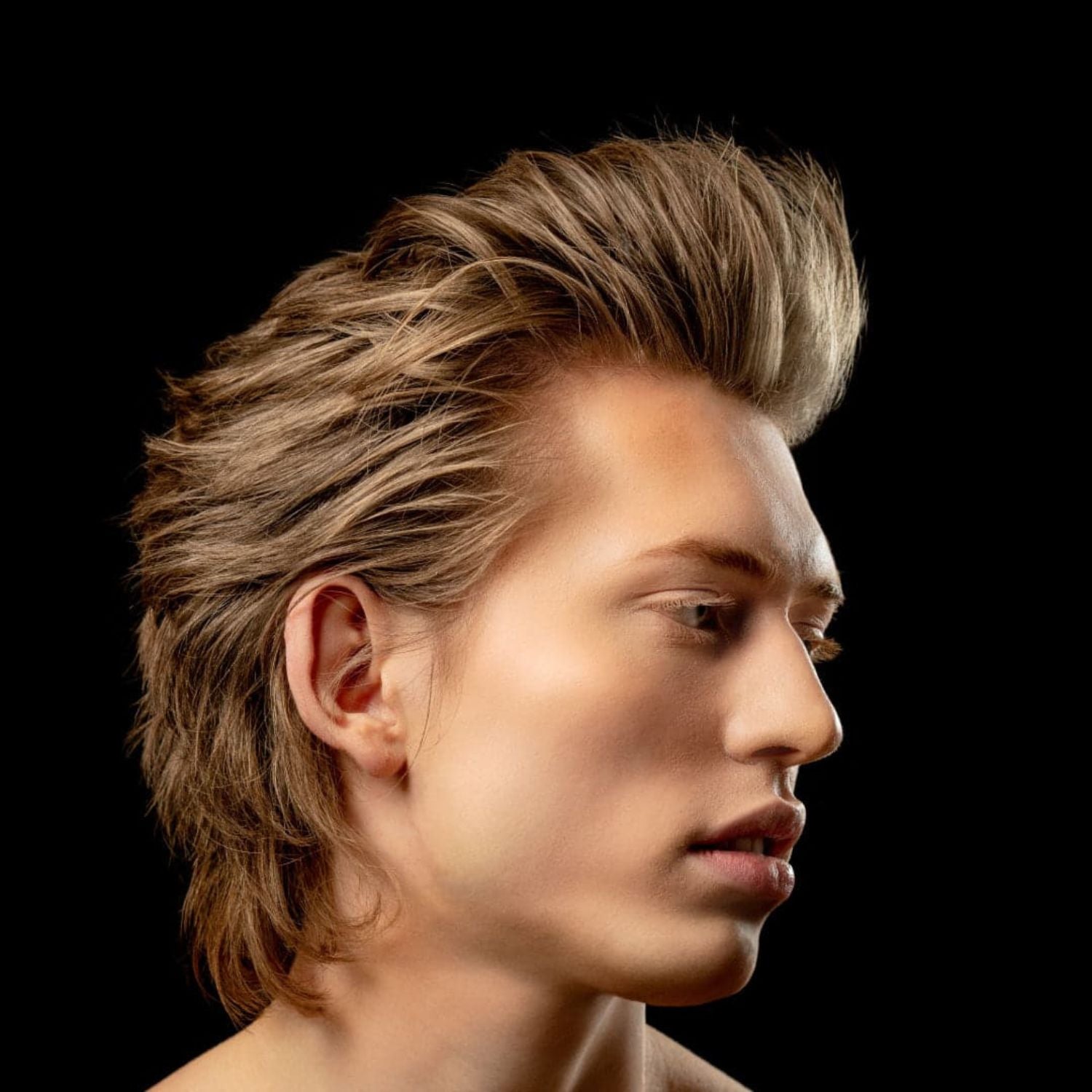 Young man with modern pompadour hair style.